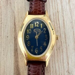 Guess ladies oval gold tone brown leather dress watch NEW BATTERY